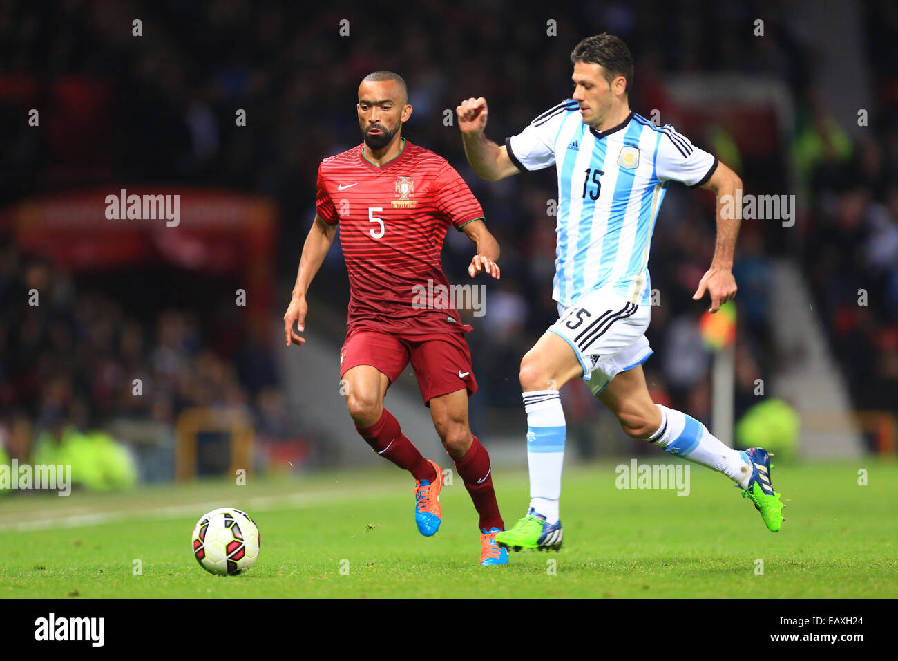 Manchester, UK. 18th Nov, 2014. Jose Bosingwa of Portugal and Martin Demichelis of Argentina - Argentina vs. Portugal - International Friendly - Old Trafford - Manchester - 18/11/2014 Pic Philip Oldham/Sportimage © csm/Alamy Live News Stock Photo