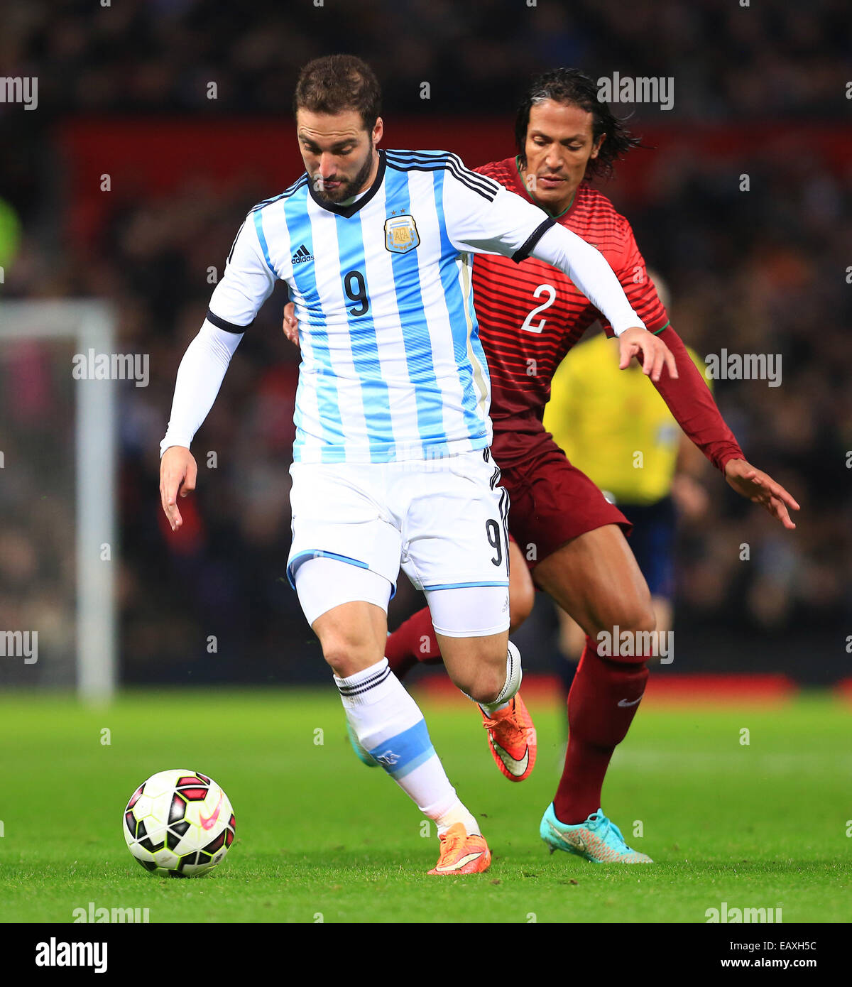 Manchester, UK. 18th Nov, 2014. Bruno Alves of Portugal and Gonzalo Higuain of Argentina - Argentina vs. Portugal - International Friendly - Old Trafford - Manchester - 18/11/2014 Pic Philip Oldham/Sportimage © csm/Alamy Live News Stock Photo