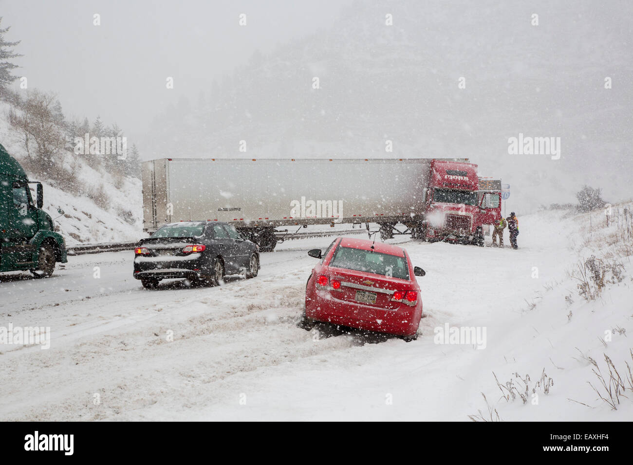 Vail, Colorado - A jackknifed truck blocks the westbound lanes of Interstate 70 during a snow storm in the Rocky Mountains. Stock Photo