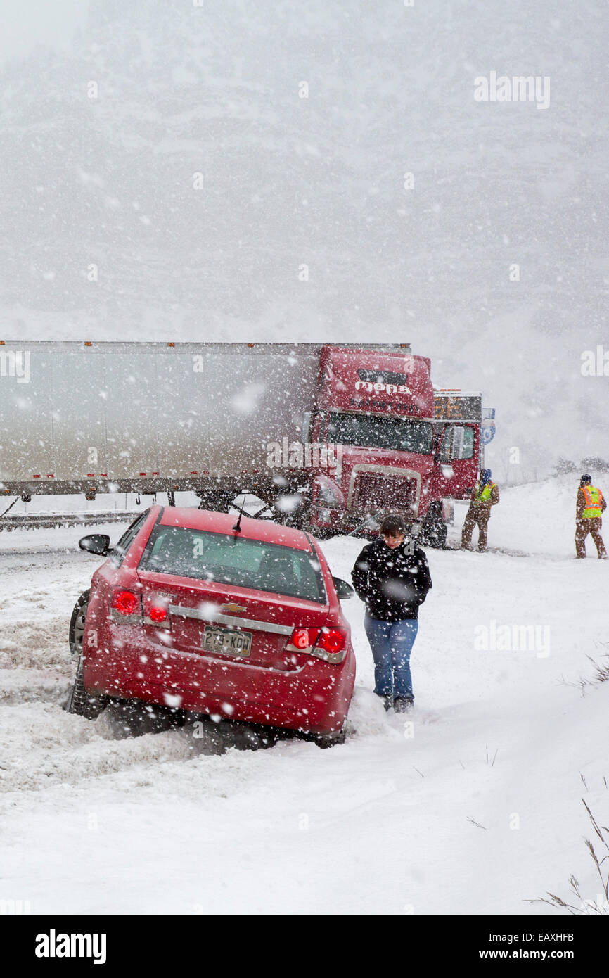 Vail, Colorado - A jackknifed truck blocks the westbound lanes of Interstate 70 during a snow storm in the Rocky Mountains. Stock Photo