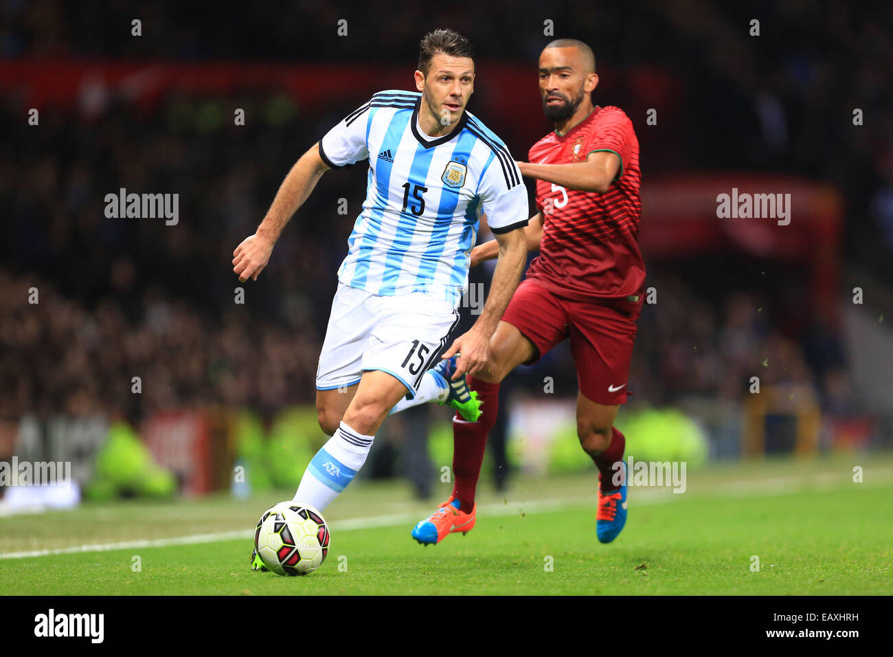 Manchester, UK. 18th Nov, 2014. Martin Demichelis of Argentina escapes Jose Bosingwa of Portugal - Argentina vs. Portugal - International Friendly - Old Trafford - Manchester - 18/11/2014 Pic Philip Oldham/Sportimage. © csm/Alamy Live News Stock Photo