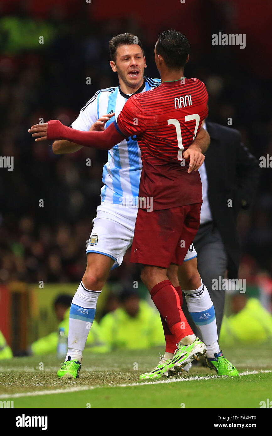 Manchester, UK. 18th Nov, 2014. Nani of Portugal battles Martin Demichelis of Argentina - Argentina vs. Portugal - International Friendly - Old Trafford - Manchester - 18/11/2014 Pic Philip Oldham/Sportimage. © csm/Alamy Live News Stock Photo