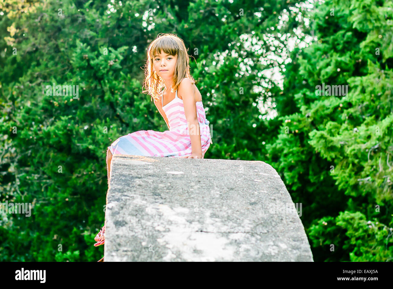 Girl sitting on top hi-res stock photography and images - Alamy