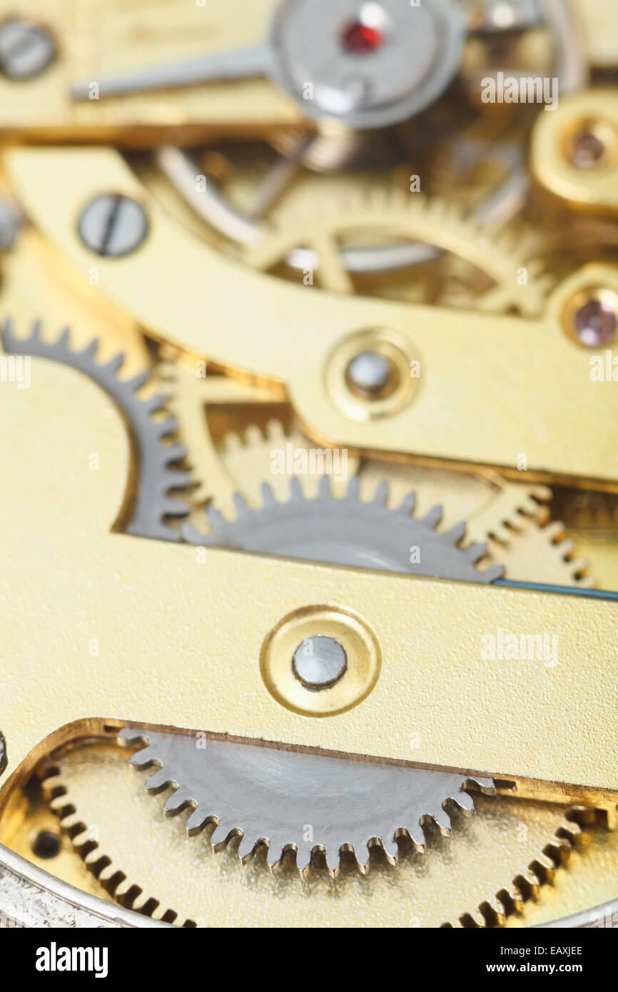 background from brass mechanical clockwork of retro clock close up