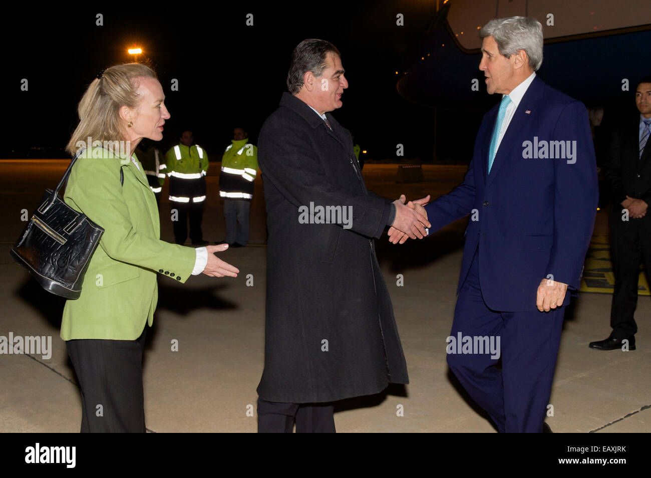 U.S. Ambassador to Jordan Alice Wells and Jordanian Ministry of Foreign Affairs Ambassador Ibrahim Awawdeh welcome U.S. Secretary of State John Kerry to Amman, Jordan, in the predawn hours of November 13, 2014, before a series of meetings with Jordanian F Stock Photo