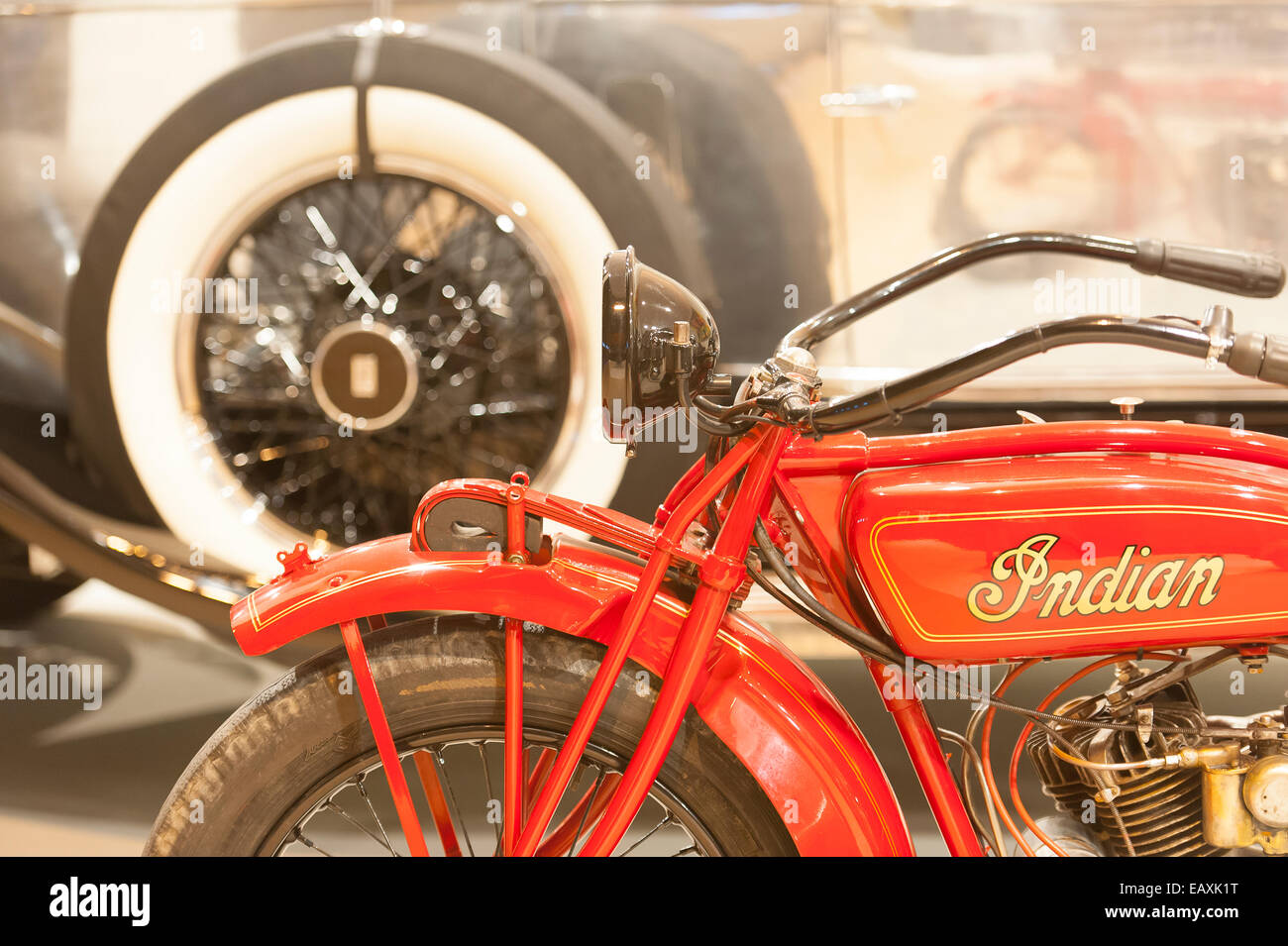 Madrid, Spain. 20th Nov, 2014. Vintage motorbike against a Rolls Royce, Pueche vintage cars stand, Feriarte art and antiques Fair, 38th edition from November 15th to 23th 2014, Ifema fair center, Madrid, Spain. Credit:  Emanuele Ciccomartino/Alamy Live News Stock Photo