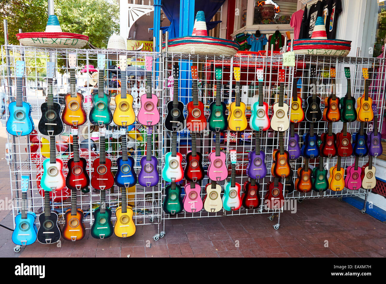 Colorful small guitars displayed on a street stall, San Antonio, Texas USA Stock Photo