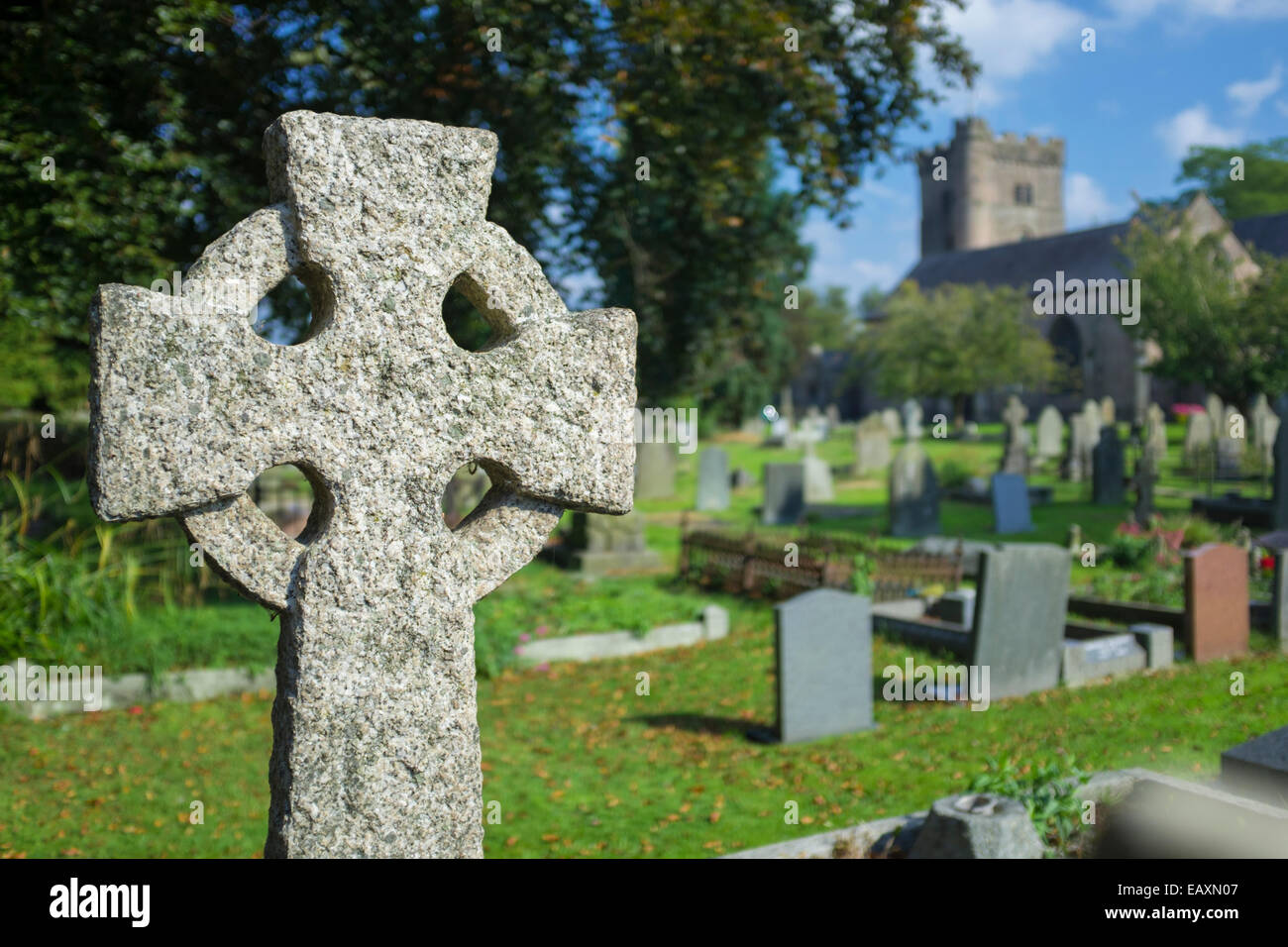 Celtic cross carved from granite at the Priory church of St Mary, Usk, South Wales. Stock Photo