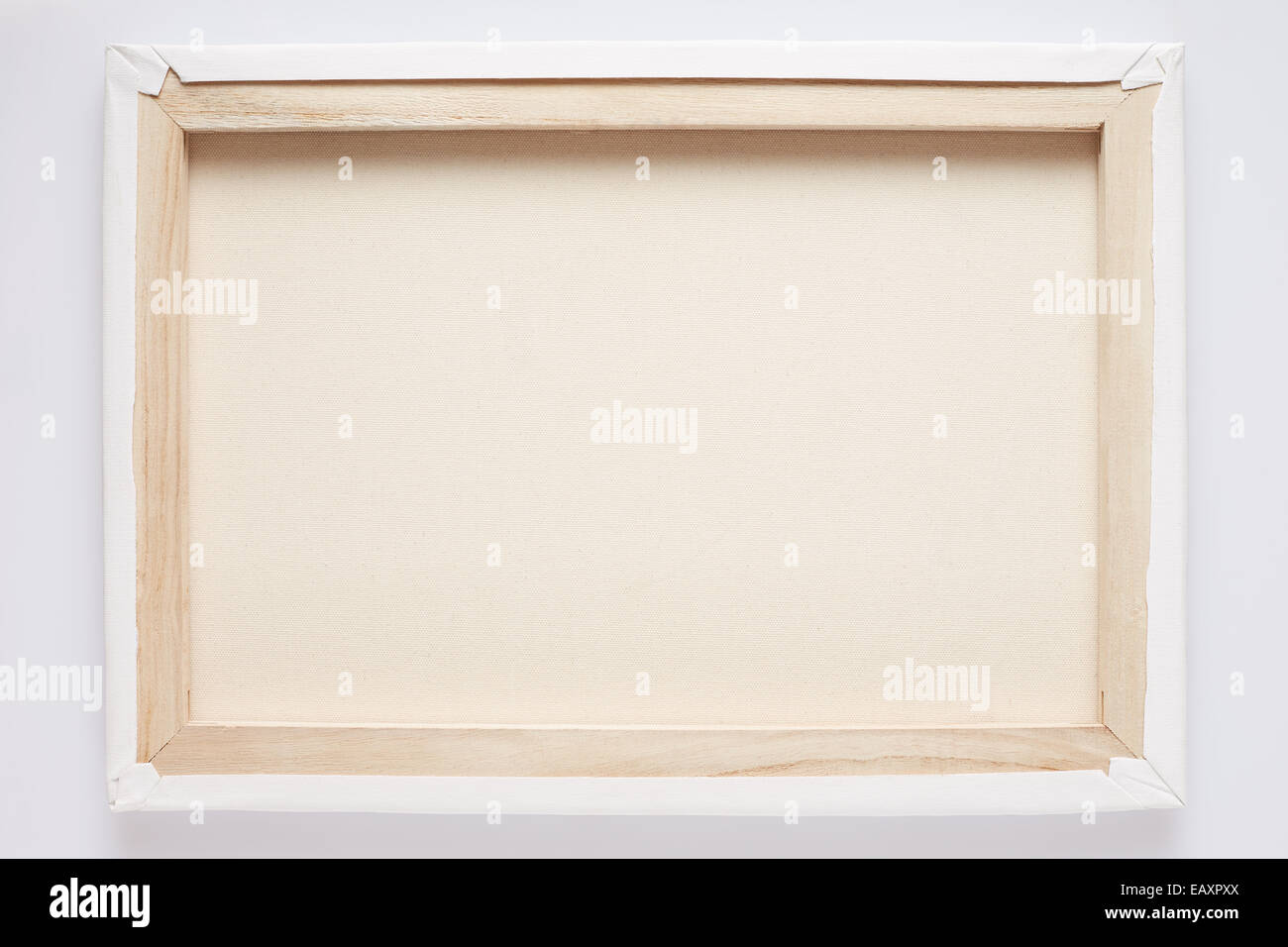 White canvas back on stretcher on white wall Stock Photo