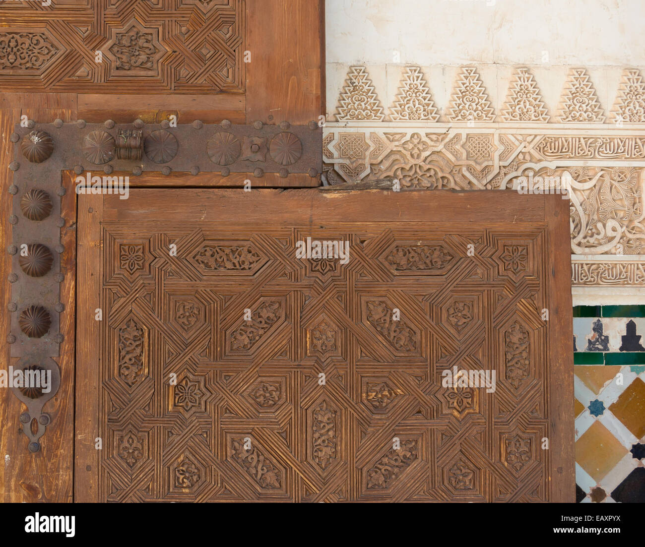 Stucco, wooden door, mosaics, wall in Alhambra, Granada, Andalusia, Spain Stock Photo