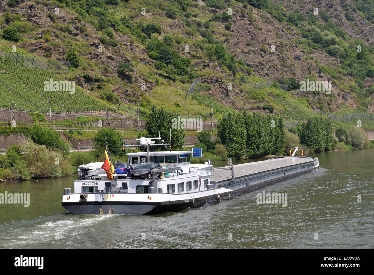 A laden Belgian registered cargo barge travels down the River Moselle near Cochem, Germany. Stock Photo