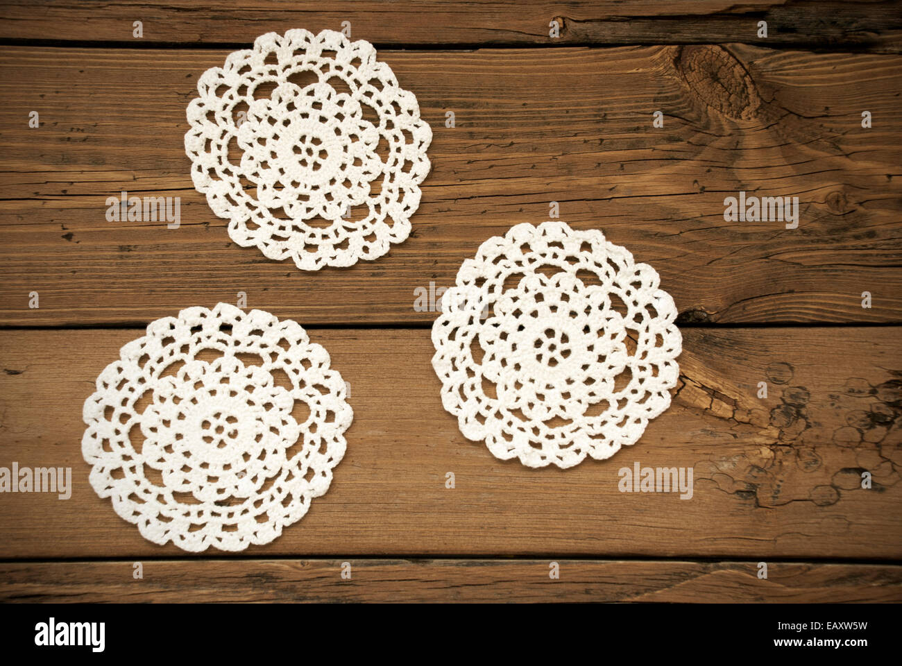 Three White Round Place Mat  On Wooden Background With Country Style Stock Photo