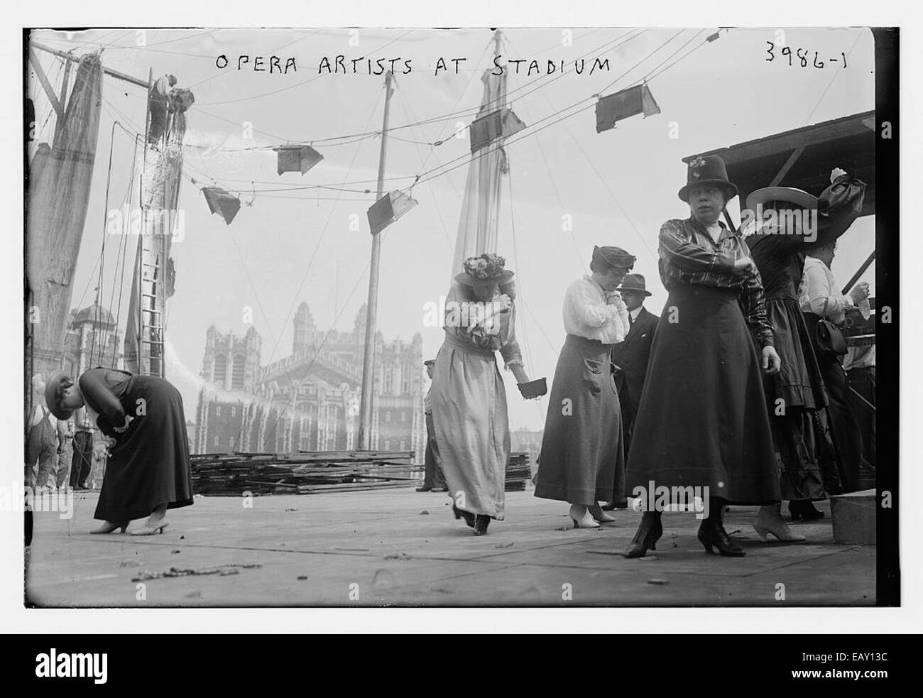 This image features opera artists performing at a stadium, capturing the grandeur and artistry of the performance in an open-air setting. The artists’ costumes and the stage layout contribute to the spectacle of the event. Stock Photo