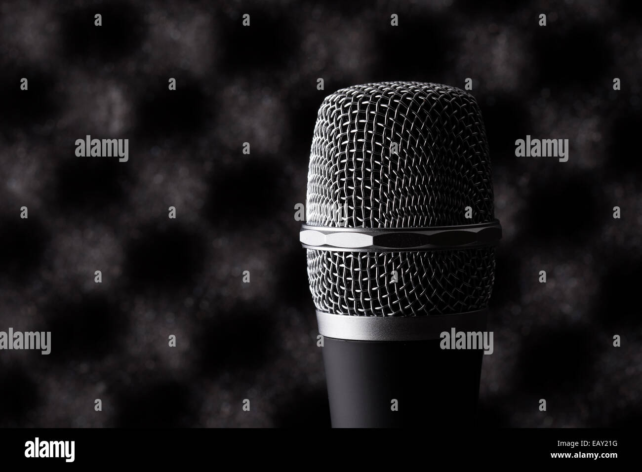 Wireless microphone closeup on foam rubber acoustic treatment background  Stock Photo - Alamy