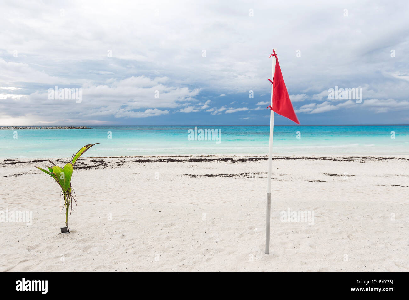 Lifeguard flag on caribbean beach, Cancun, Mexico Stock Photo