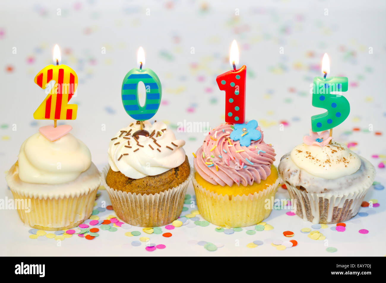2015 new year cupcakes on abstract colorful background concept Stock Photo