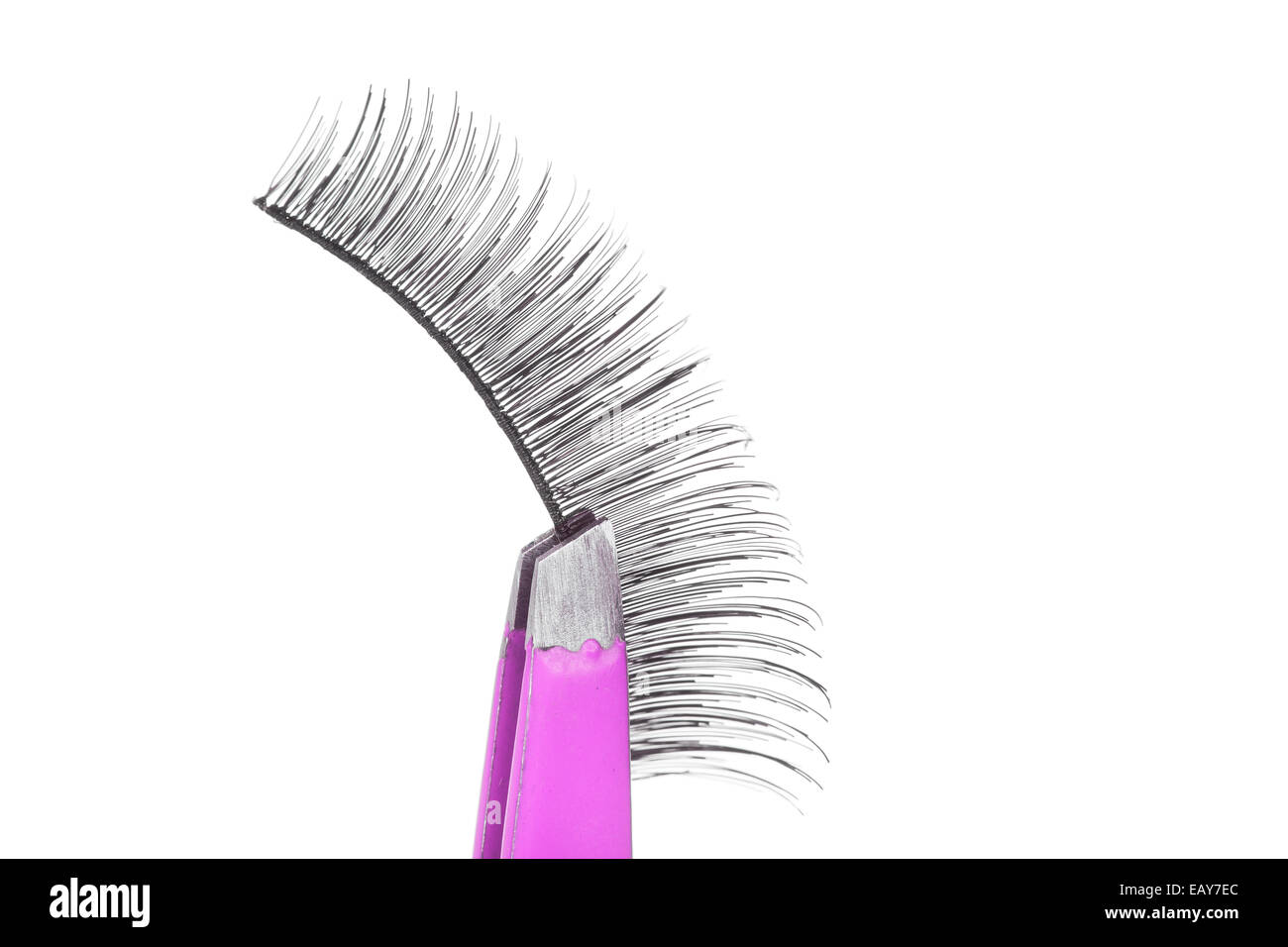 False lashes and pink pincers, closeup on white background Stock Photo