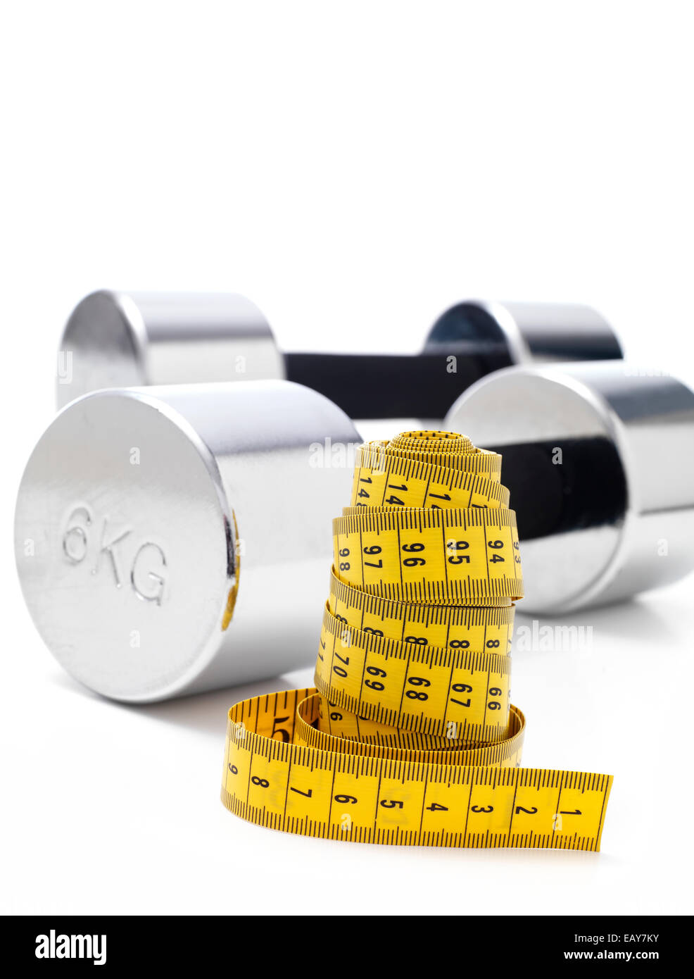 Gym Dumbbells isolated with a tape measure Stock Photo