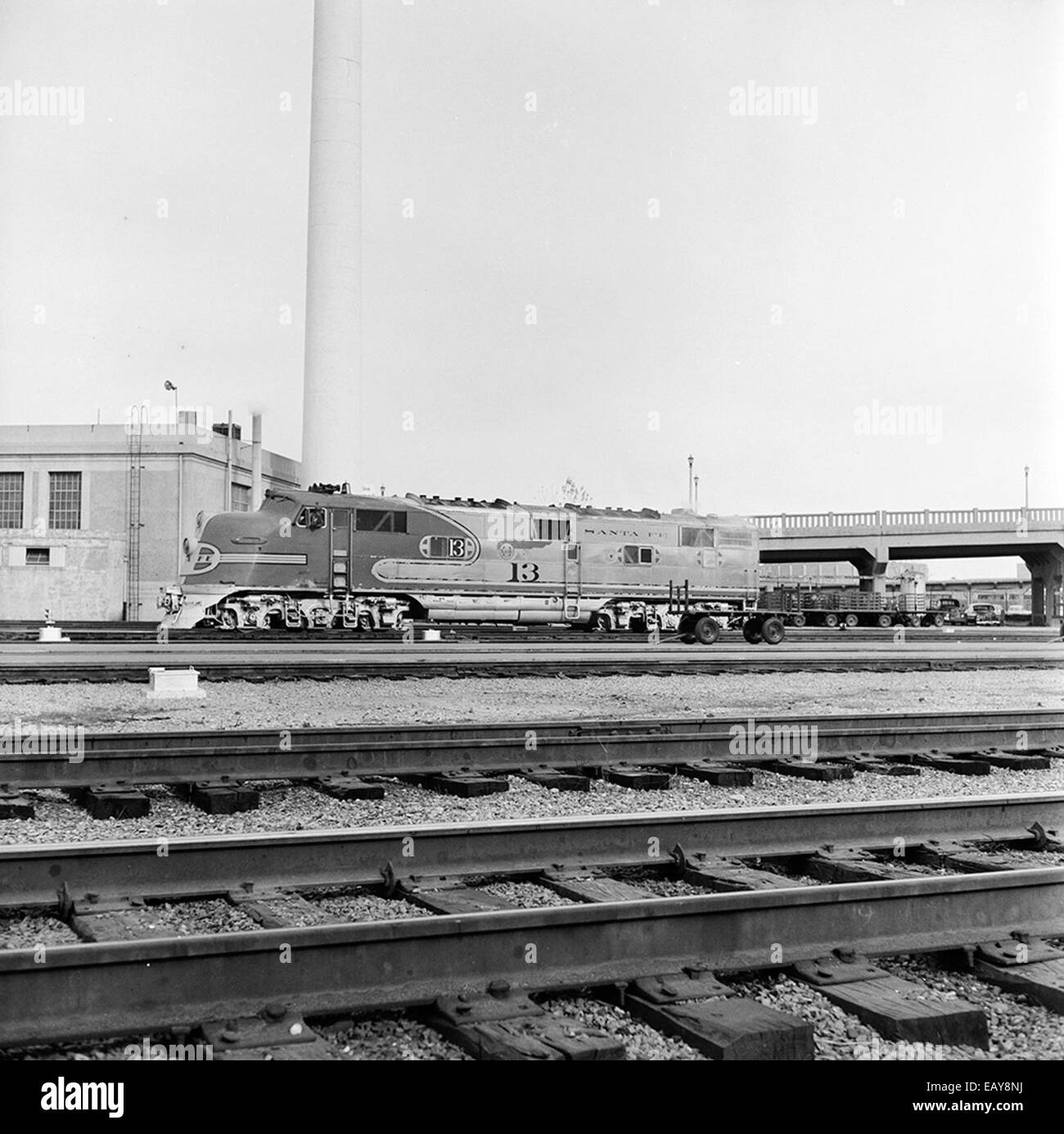 [Atchison, Topeka, & Santa Fe, Diesel Electric Passenger Locomotive No. 13, in Front of Smokestack] [Atchison, Topeka, & Santa Fe, Diesel Electric Passenger Locomotive No. 13, in Front of Smokestack] Stock Photo