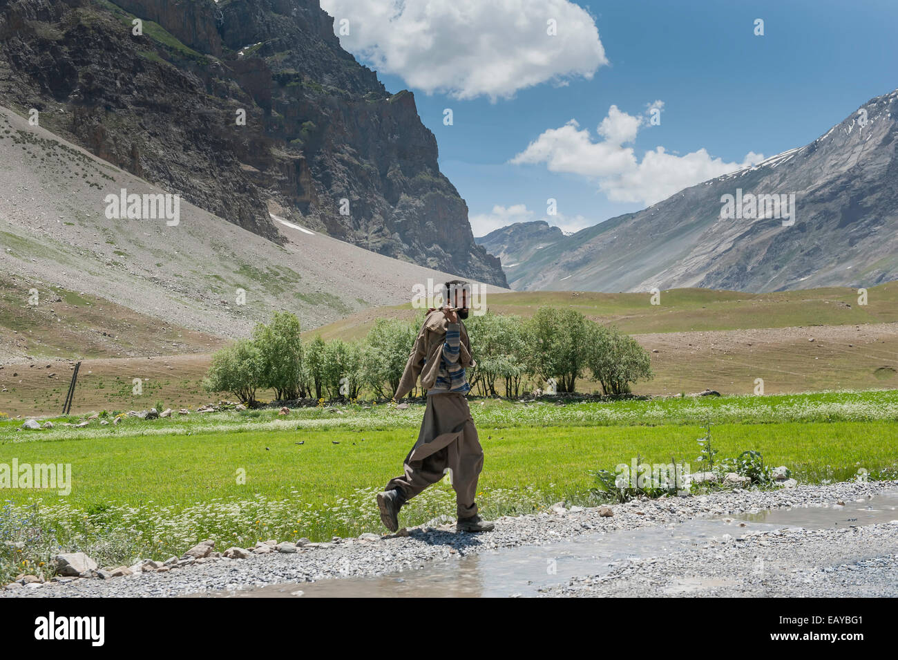 Himalayan Life Style, man walking in mountains Stock Photo