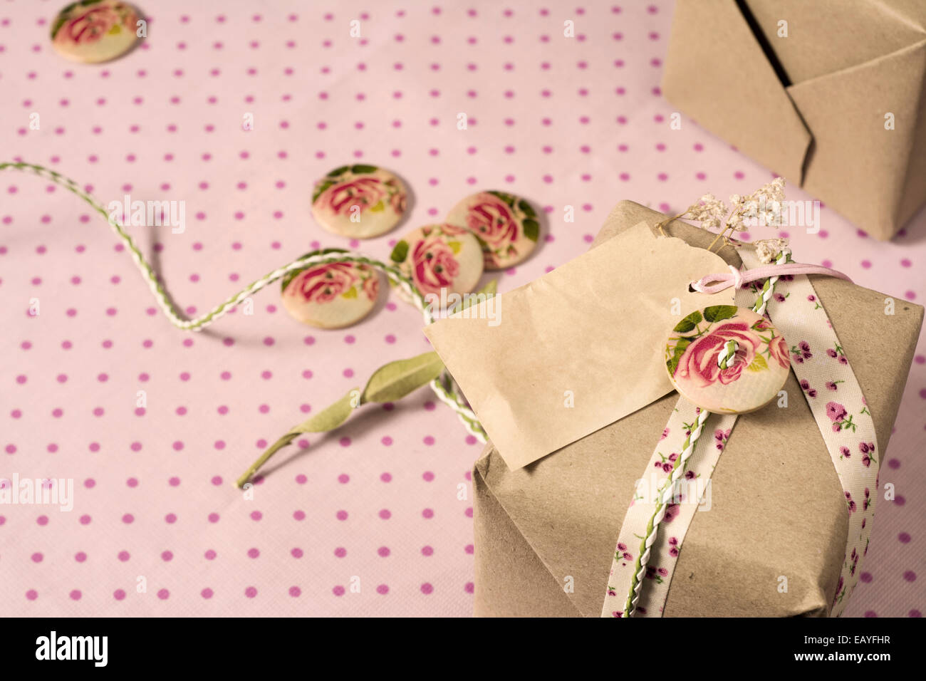 Gift wrapped in recyclable paper, ribbons, decorated with wooden ...