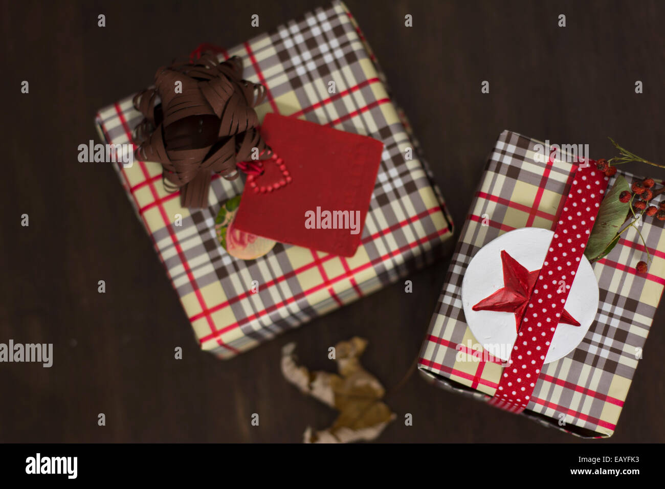 presents wrapped in checkered paper and dotted ribbon with red star