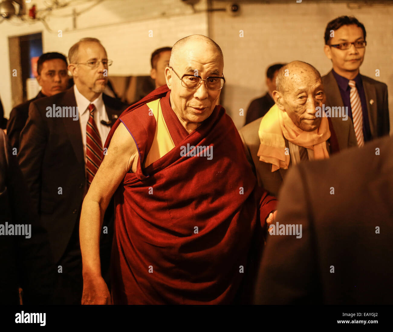 The Dalai Lama enters the Beacon Hotel surrounded by a U.S. Department of  State and Tibetan security detail in New York City Stock Photo - Alamy