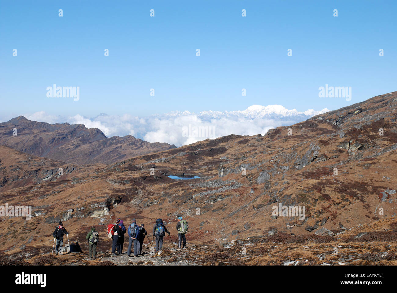 A group of Trekkers on a high point on the Singalila ridge in the Indian Himalayas close to the mountain of Kanchenjunga Stock Photo