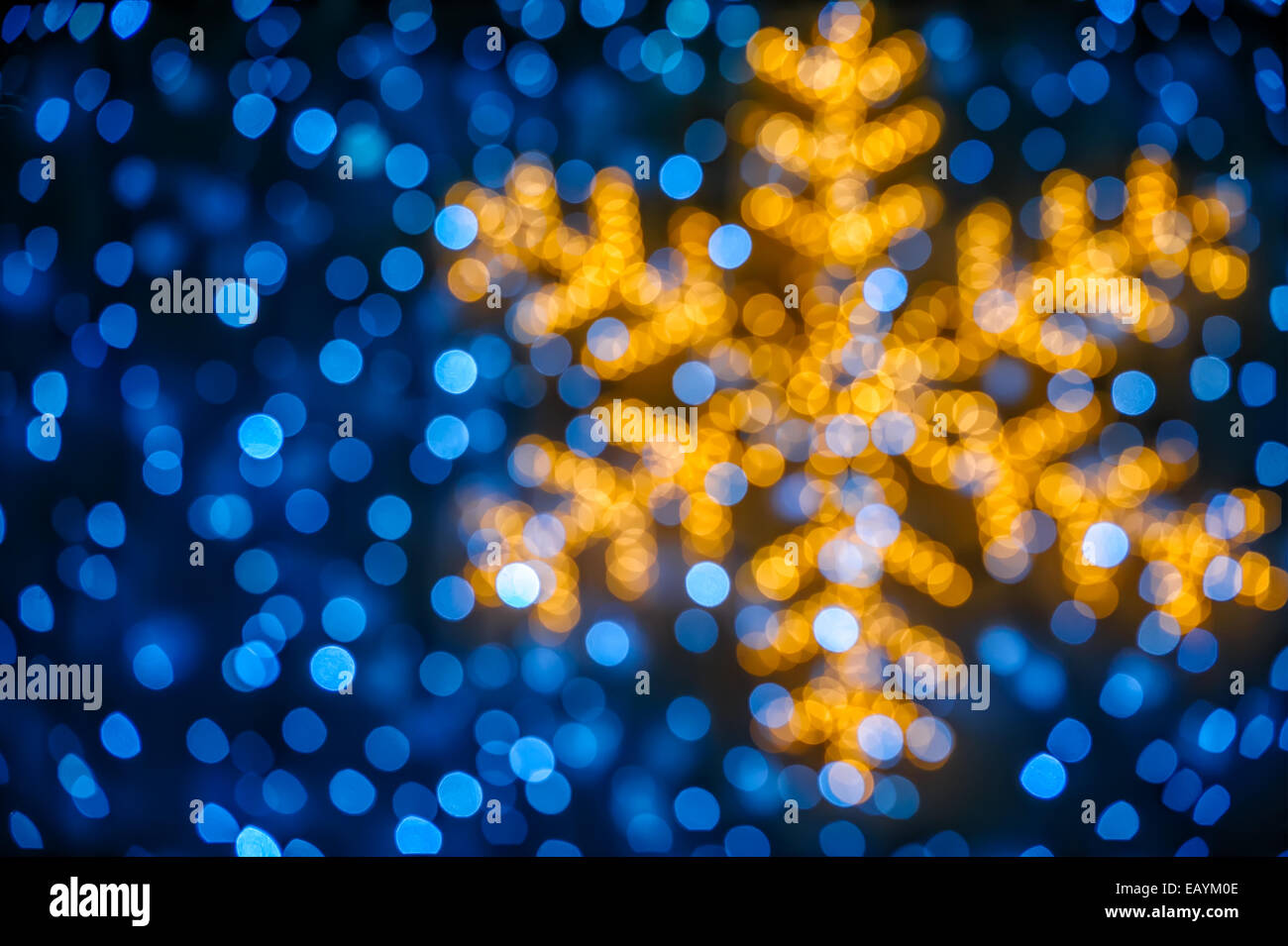 Christmas background with blurred snowflake and blue lights Stock Photo ...