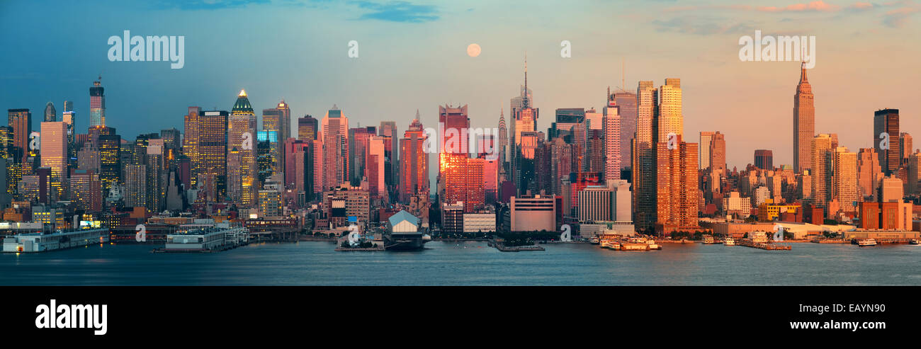 New York City day and night. This photo is blended with sunset and twilight shots. Stock Photo