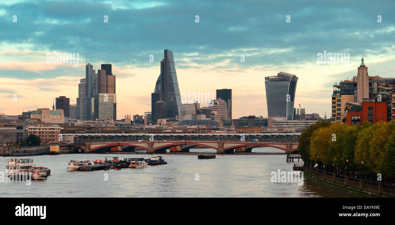London cityscape at sunset panorama with urban buildings over Thames River Stock Photo