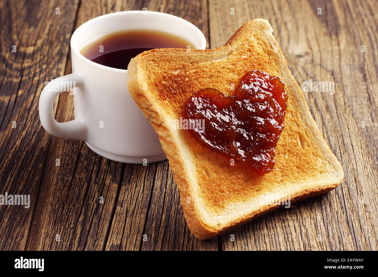 Cup of tea and toast bread with jam in shape of hearts on vintage Stock Photo 75600643 Alamy