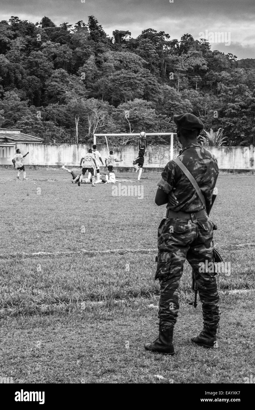 Football matches in Príncipe island (Gulf of Guinea)are followed passionately and security is kept by the presence of the army Stock Photo