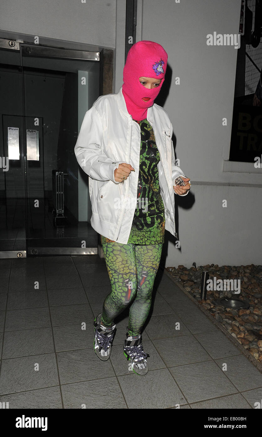 Rita Ora leaving a recording studio wearing a pink Balaclava and a