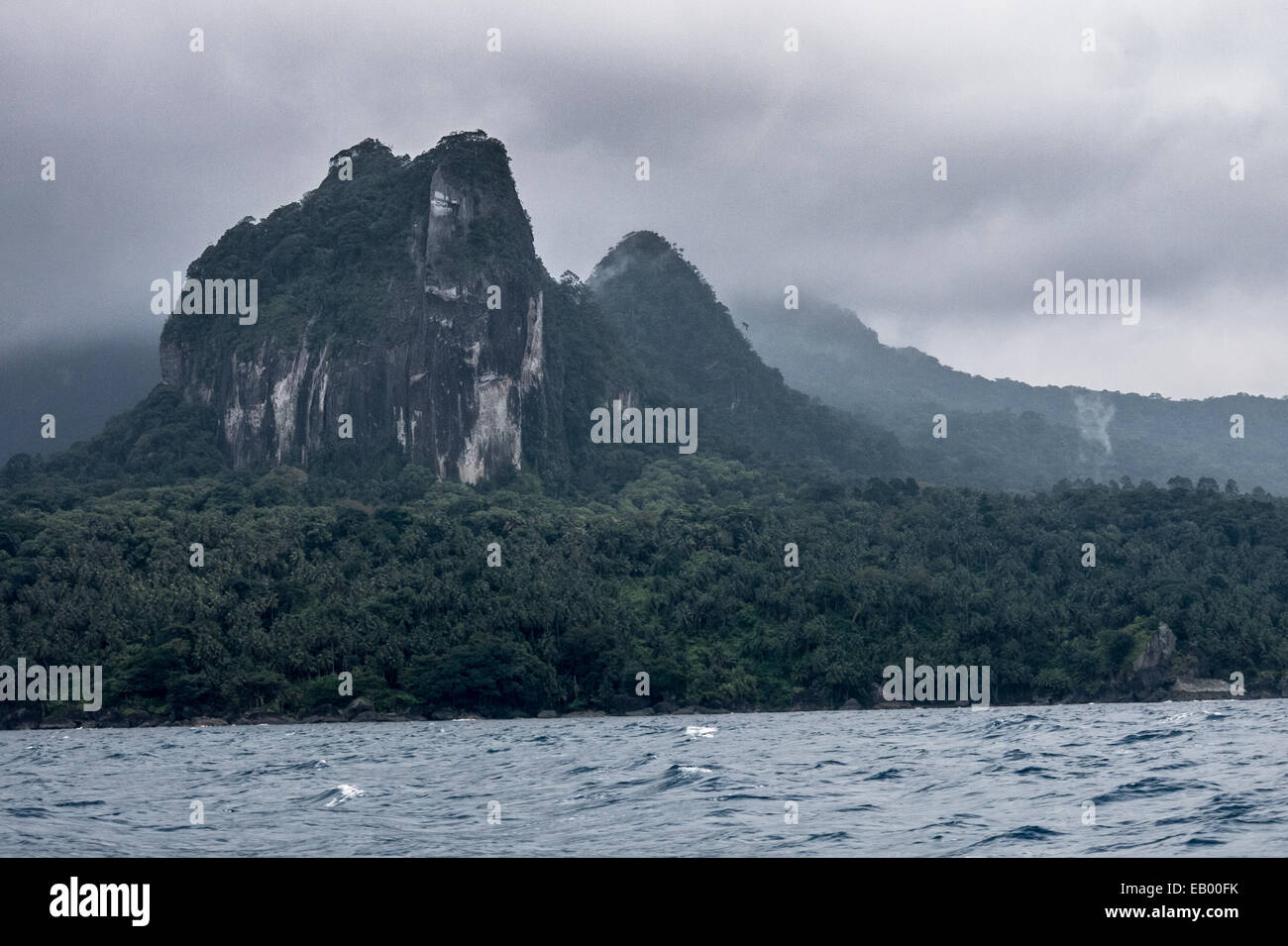 The inaccessible southern rainforest of the island of Príncipe (São Tomé and Príncipe, Gulf of Guinea) seen from the sea Stock Photo