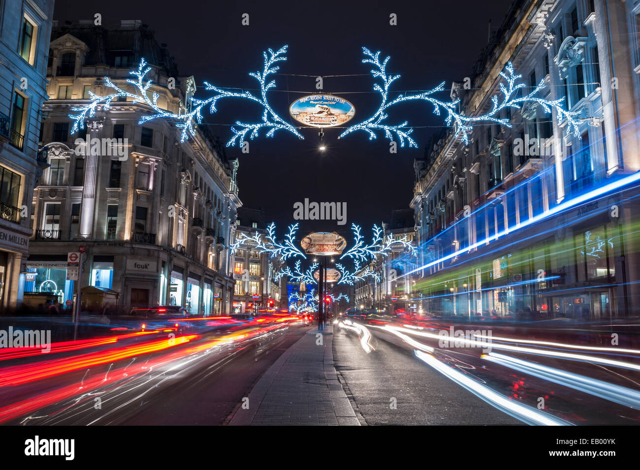 London, 22 November 2014. A long exposure produces light trails of passing  traffic down Regent Street. This year's Christmas lights promote the movie " Night at the Museum 2 - Secret of the