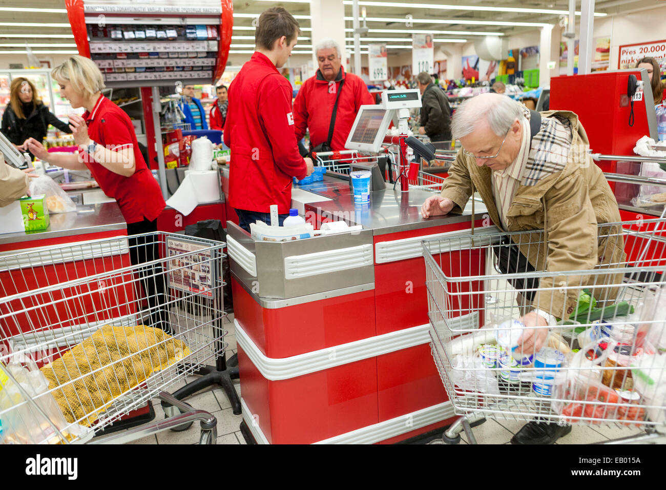 People shopping Shoppers Supermarket trolley, Prague, Czech Republic checkout supermarket Stock Photo