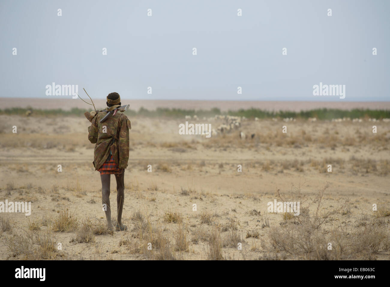 Turkana warrior in the desert, Kenya Stock Photo