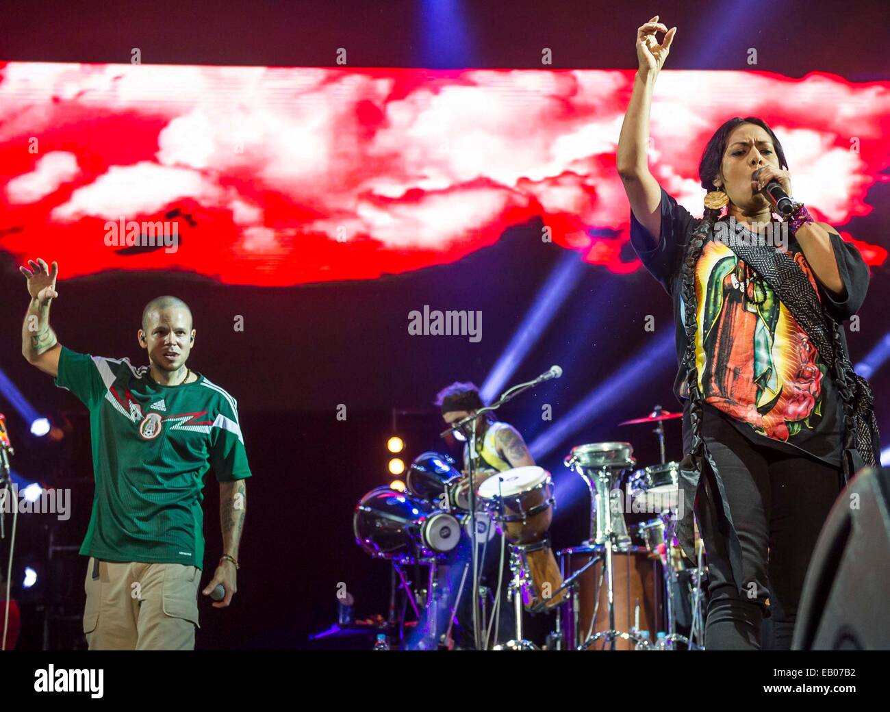 Mexico City, Mexico. 22nd Nov, 2014. Mexican singer Lila Downs (R), sings along with Puerto Rican band 'Calle 13', during a concert of 'Multiviral 2014' tour, in Mexico City, capital of Mexico, on Nov. 22, 2014. © NOTIMEX/Xinhua/Alamy Live News Stock Photo