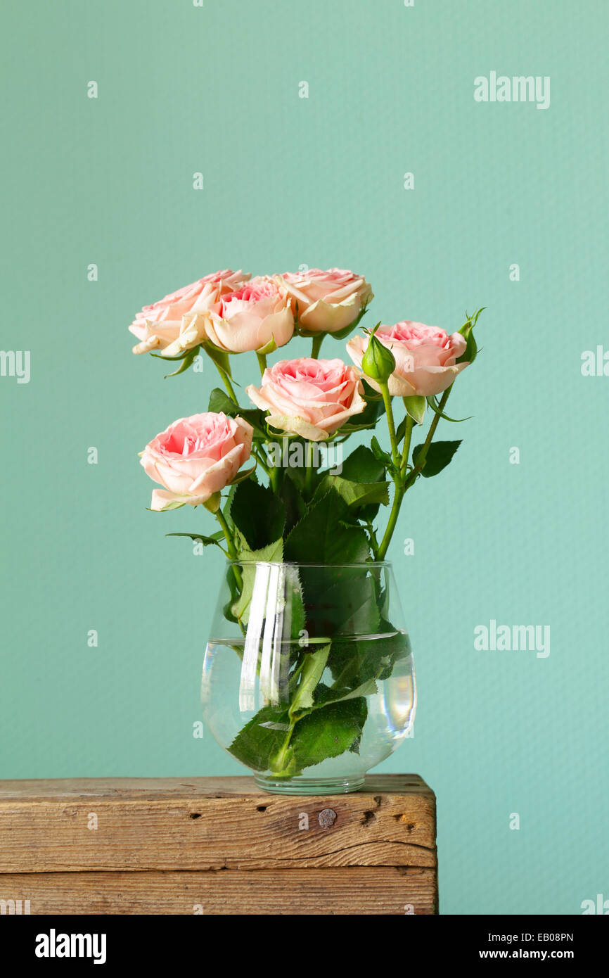 bouquet of pink roses in a glass vase Stock Photo - Alamy