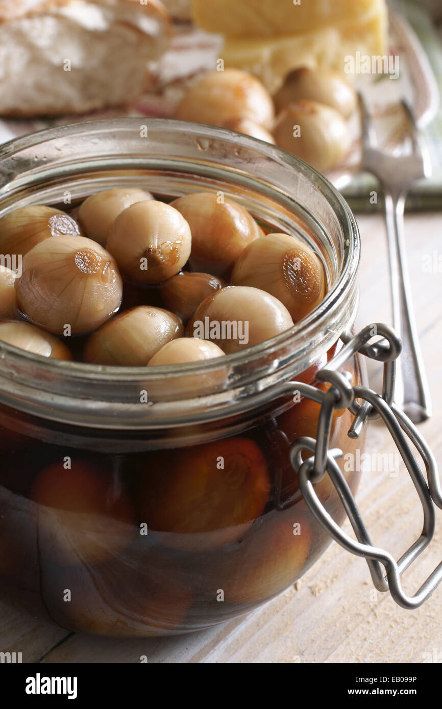 Home made pickled onions in malt vinegar served with bread and cheese