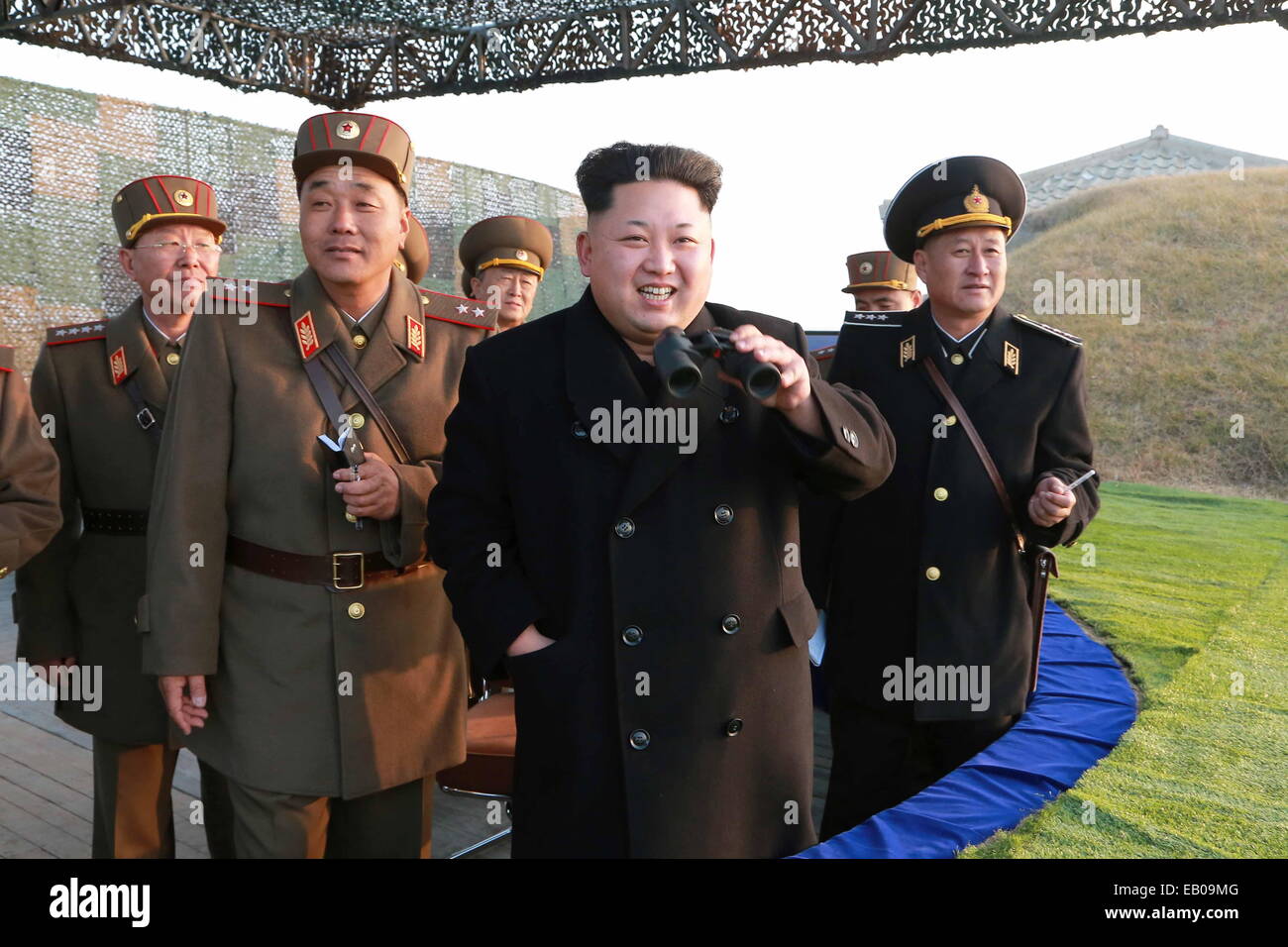 Pyongyang, DPRK. 23rd November, 2014. Photo provided by Korean Central News Agency (KCNA) on Nov.23, 2014 shows top leader of the Democratic People's Republic of Korea (DPRK) Kim Jong Un (Front) inspecting a combined joint drill of the units under KPA Large Combined Units 572 and 630. Kim Jong Un watched the whole process of the exercise and required all military units to rehearse under simulated conditions of a real war and be well prepared at all times. (Xinhua/KCNA) Credit:  Xinhua/Alamy Live News Stock Photo