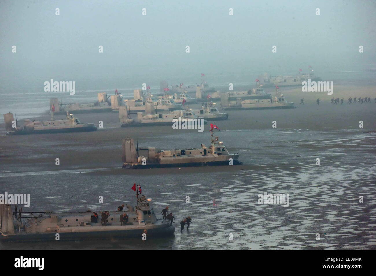 Pyongyang, DPRK. 23rd November, 2014. Photo provided by Korean Central News Agency (KCNA) on Nov.23, 2014 shows a combined joint drill of the units under KPA Large Combined Units 572 and 630 of the Democratic People's Republic of Korea (DPRK). DPRK's top leader Kim Jong Un watched the whole process of the exercise and required all military units to rehearse under simulated conditions of a real war and be well prepared at all times. (Xinhua/KCNA) Credit:  Xinhua/Alamy Live News Stock Photo