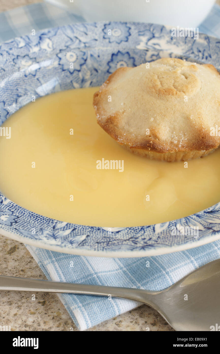 Mini apple pie and custard Stock Photo