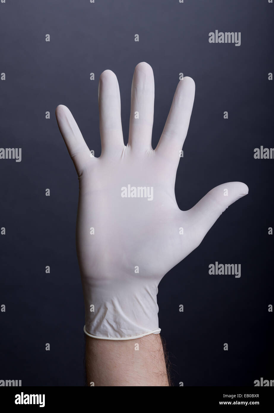 Male palm in latex glove Stock Photo