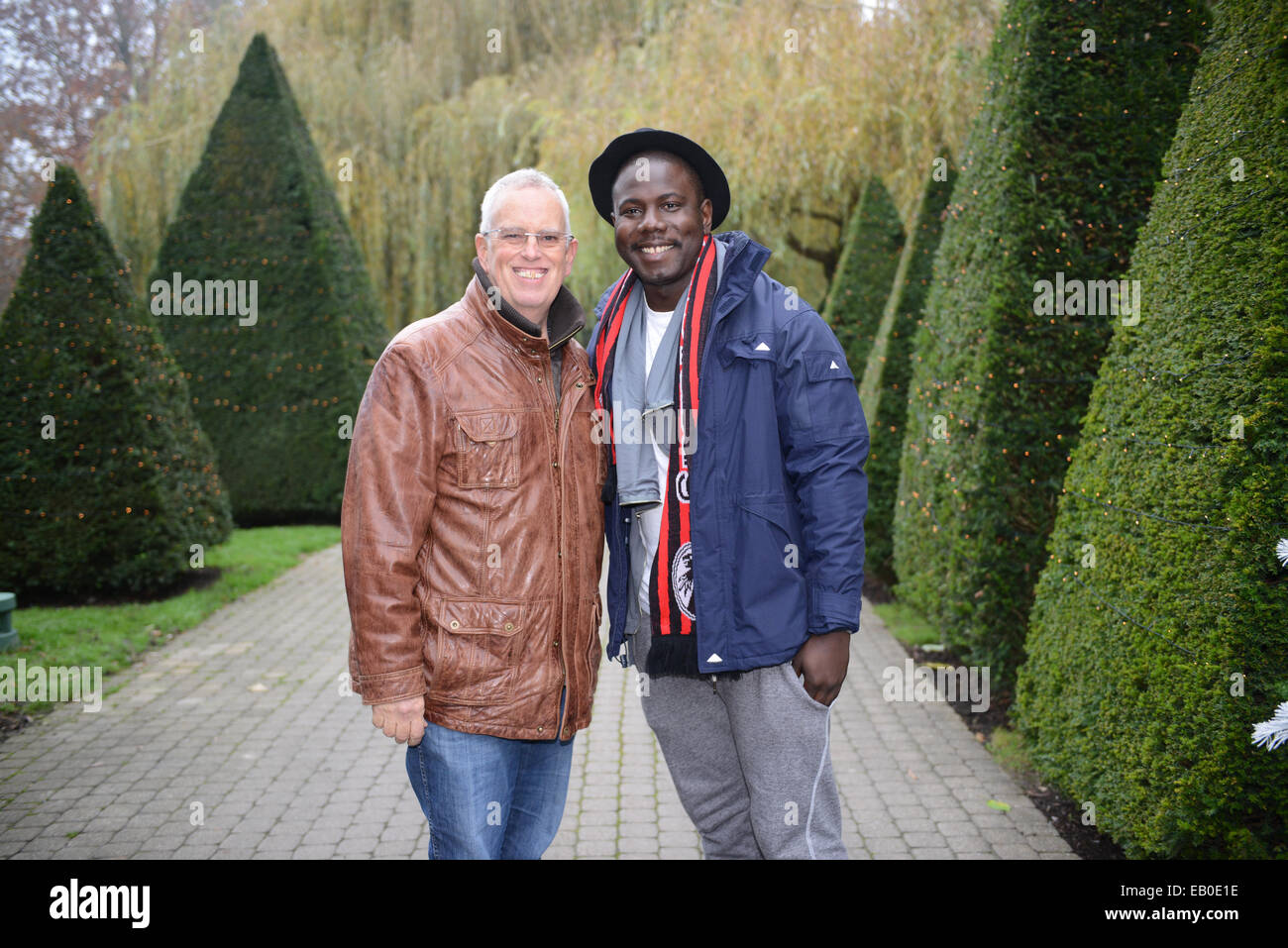 Rust, Germany. 22nd Nov, 2014. British documentary filmmaker Eugene Chaplin (L), son of legendary actor Charlie Chaplin, and Kewku Mandela (R), grandson of South African freedom fighter and former president Nelson Mandela, pose at Europa Park in Rust, Germany, 22 November 2014. Photo: PATRICK SEEGER/dpa/Alamy Live News Stock Photo