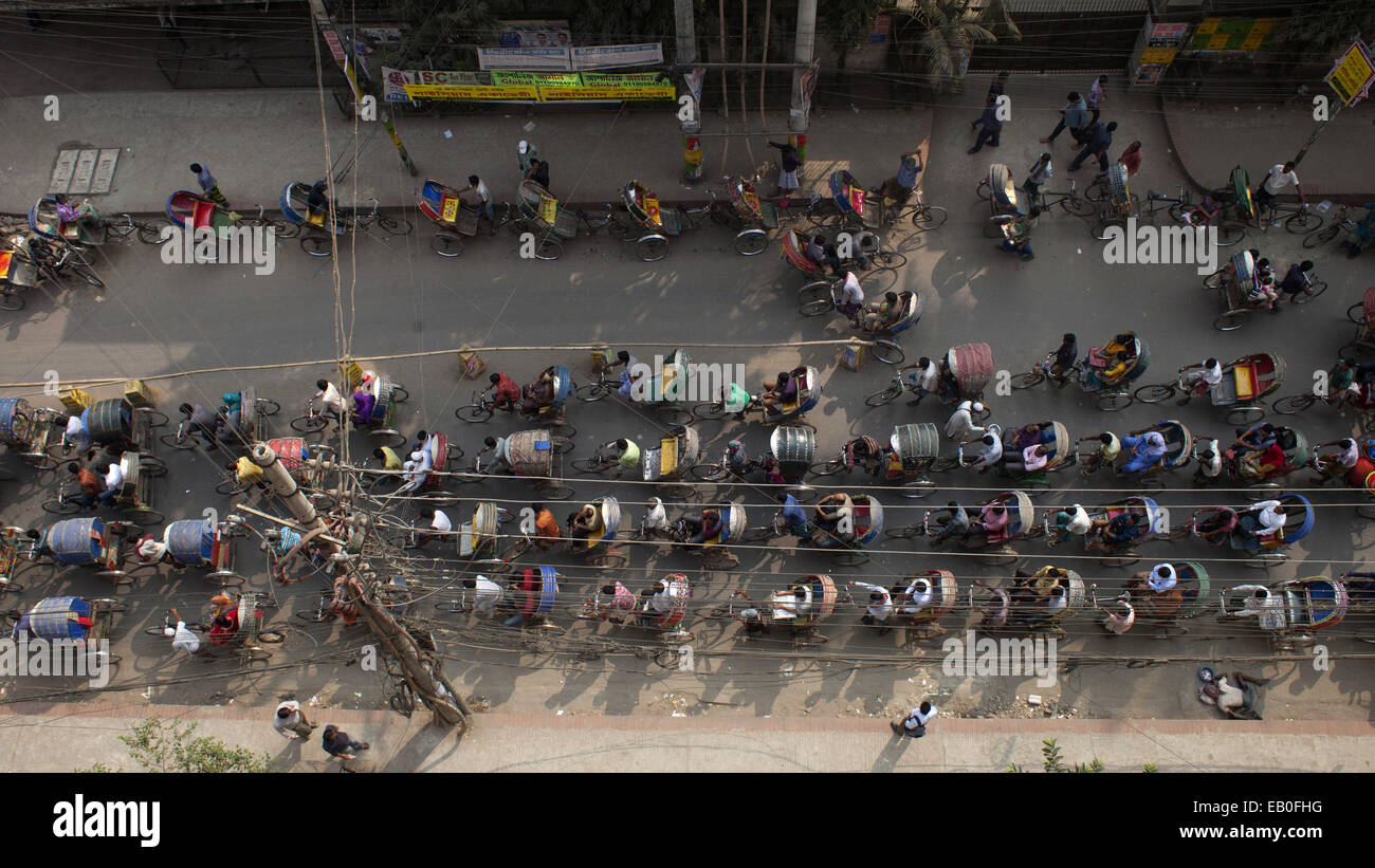 Dhaka, Bangladesh. 23rd Nov, 2014. A busy Rickshaw way in Dhaka, Bangladesh.Rickshaw of Dhaka recorded at Guinness World Records 2015 making heading ''most cycle rickshaw in one town''.In Dhaka city about 5 Lac rickshaw available.15 million people living in Dhaka city and 40% people travelling in the city by rickshaw. © Zakir Hossain Chowdhury/ZUMA Wire/Alamy Live News Stock Photo