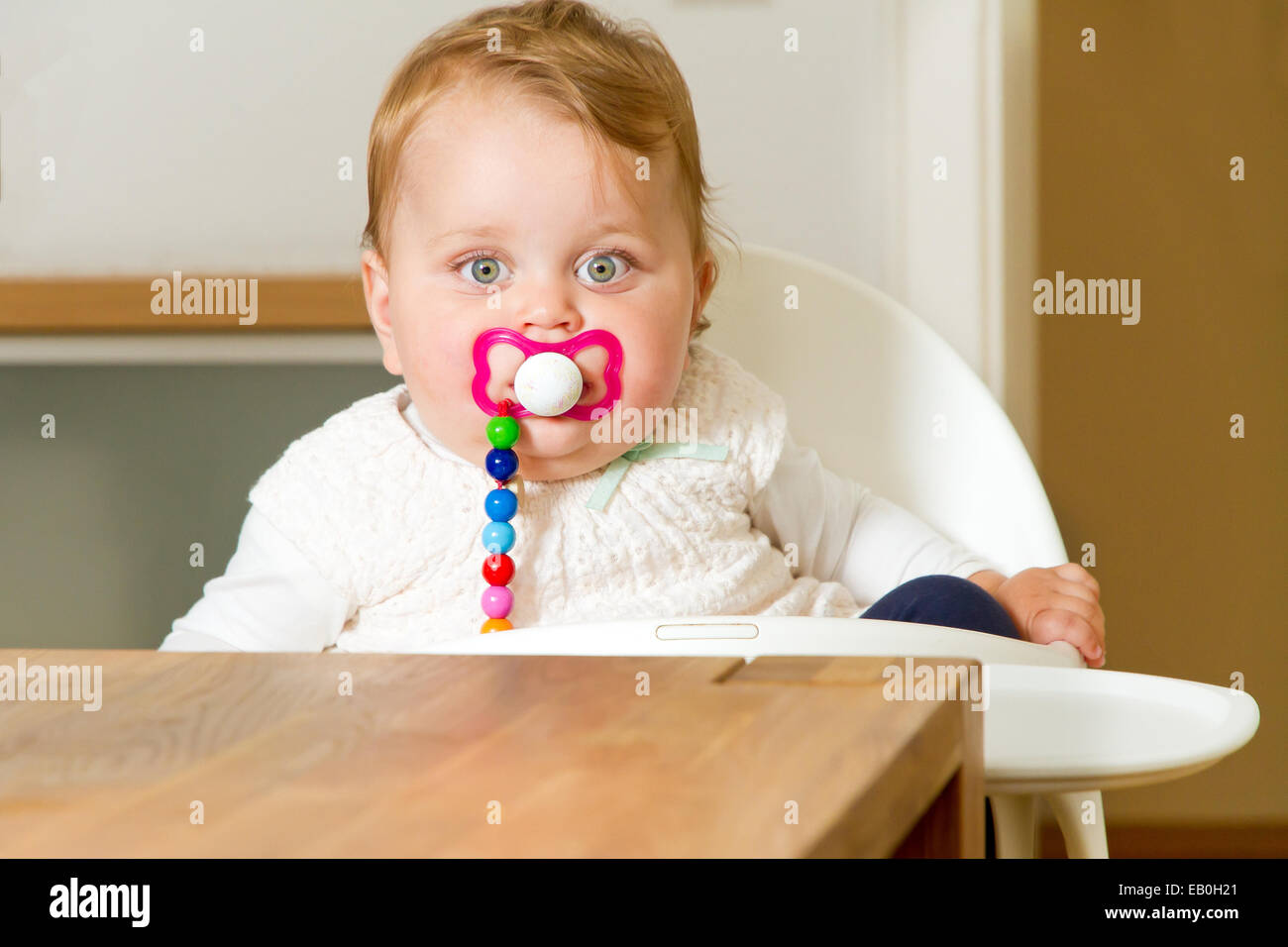 Cute littel toddler with soother Stock Photo