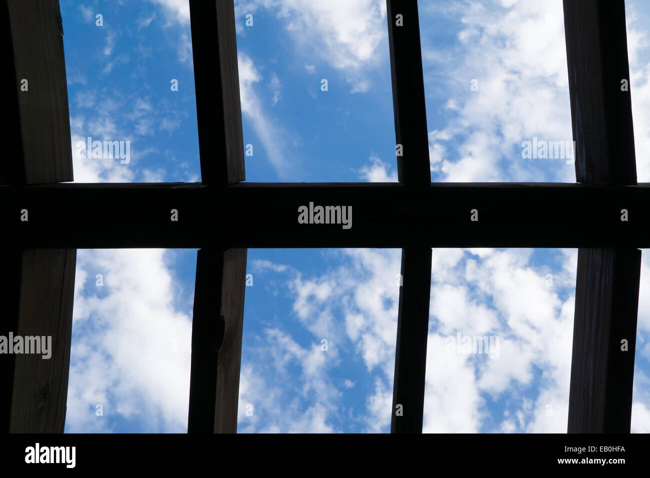 view of ckoudy sky through the ceiling Stock Photo