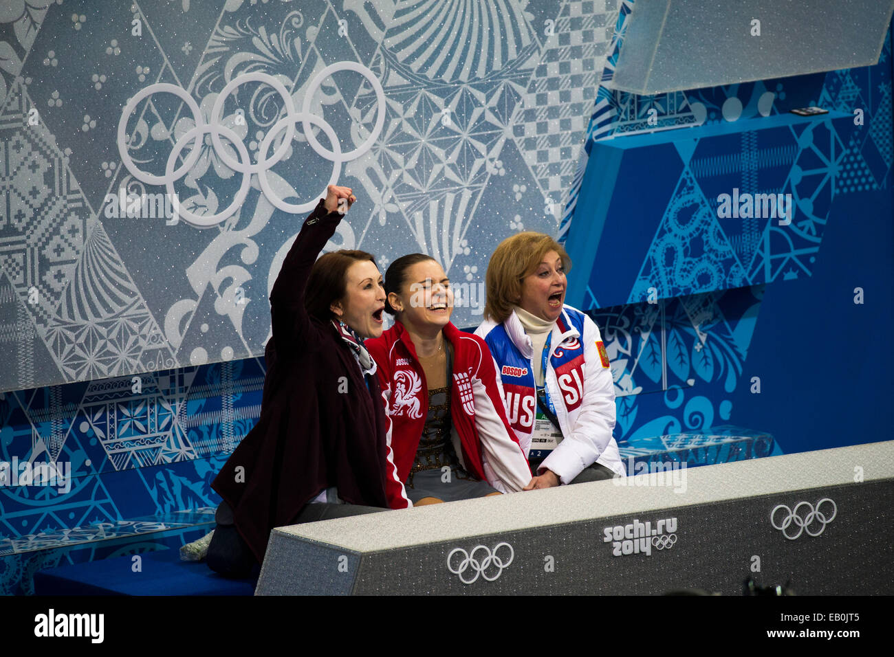 Olympic Champion Adelina Sotnikova (RUS) and her coach Elena Buianova (R)  and choreographer Irina Tagaeva in the kiss and cry ar Stock Photo - Alamy